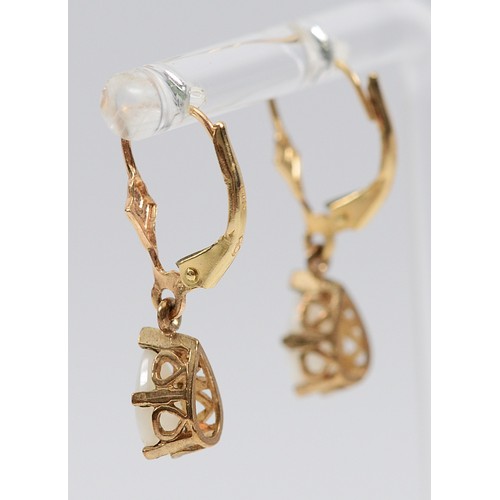 25 - A pair of 14K gold opal hinge back earrings, 1.7g