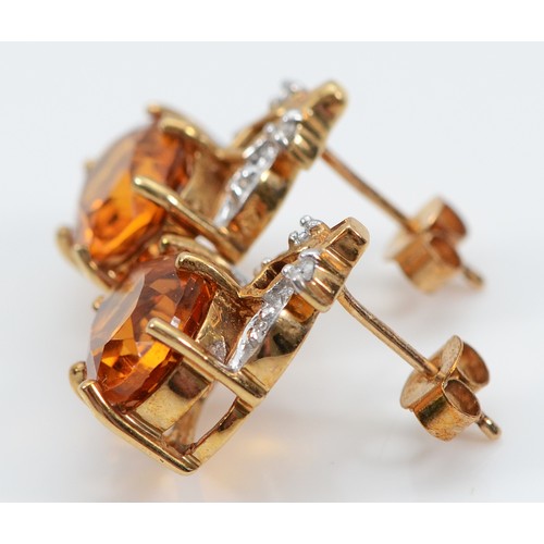 34 - A pair of 9ct gold brilliant cut diamonds and citrine earrings with scroll backs, 15mm drop, 4g