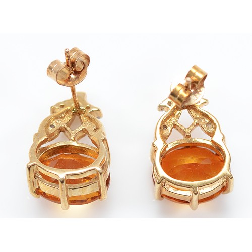 34 - A pair of 9ct gold brilliant cut diamonds and citrine earrings with scroll backs, 15mm drop, 4g