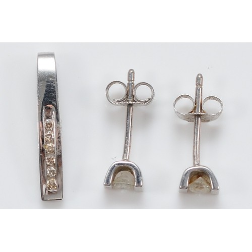 40 - A pair of 9ct white gold brilliant cut diamond earrings with scroll backs, approximately 0.10ct each... 