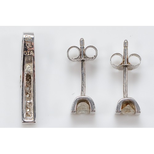 40 - A pair of 9ct white gold brilliant cut diamond earrings with scroll backs, approximately 0.10ct each... 