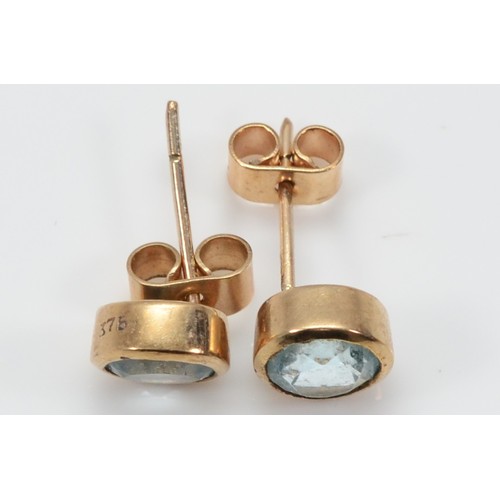 46 - A pair of 9ct gold aquamarine earrings with scroll backs, 6mm, 1.9g