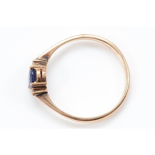 55 - A 14K gold sapphire and brilliant cut diamond three stone ring, M, 1.5g