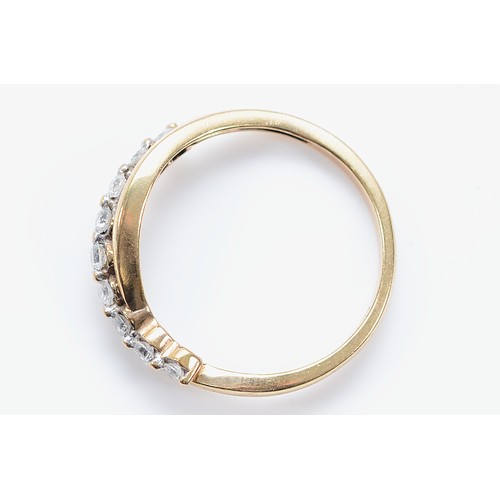 58 - A 9ct gold brilliant cut diamond cross over ring, one diamond loose in it's setting, N, 1.7g