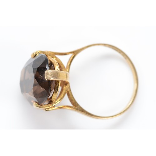 59 - A 9ct gold smokey quartz cocktail ring, 18mm x 14mm smokey quartz, London 1989, P 1/2, 5.3g