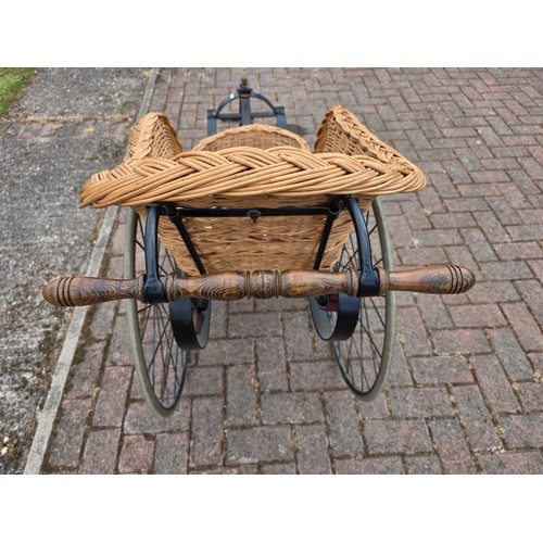  Wickerwork bath chair, with wrought metal frame, early 20th century, solid rubber tyres, spring seat... 