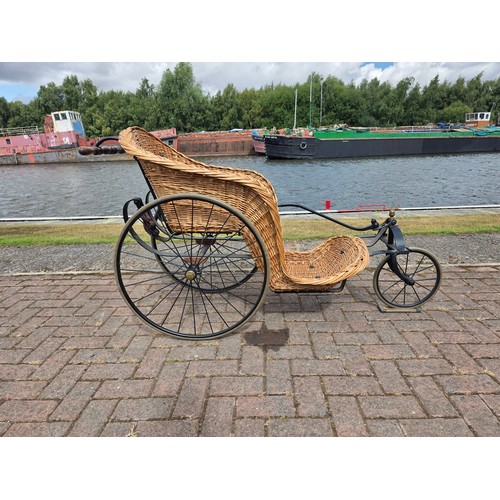  Wickerwork bath chair, with wrought metal frame, early 20th century, solid rubber tyres, spring seat... 