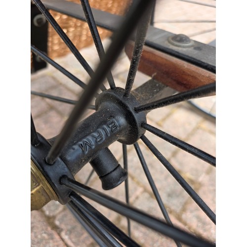  Wickerwork bath chair, with wrought metal frame, early 20th century, solid rubber tyres, spring seat... 