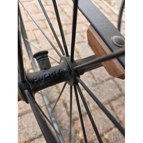  Wickerwork bath chair, with wrought metal frame, early 20th century, solid rubber tyres, spring seat... 