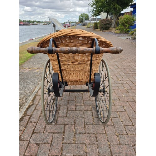  Wickerwork bath chair, with wrought metal frame, early 20th century, solid rubber tyres, spring seat... 