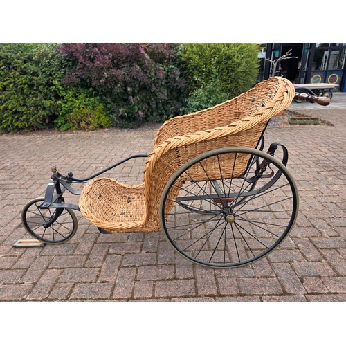  Wickerwork bath chair, with wrought metal frame, early 20th century, solid rubber tyres, spring seat... 