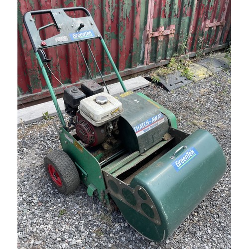 A Greenter, Thatch Away, walk behind turf maintenance unit, fitted with a Honda 4 stroke petrol engine.