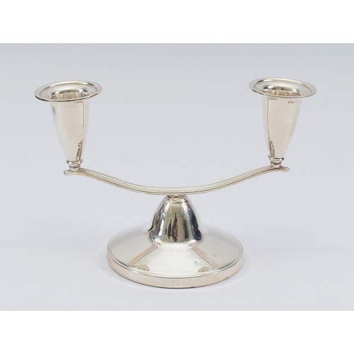 A silver twin armed candelabra, Birmingham 1964, by Elkington & Co, 10x16cm, loaded.