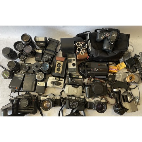 A collection of cameras to include a Canon AE-1, a Canon AV-1, a Rollei 35 LED, a Kodak Easyshare Max 2990 and others. 18.3kg. 2 boxes.