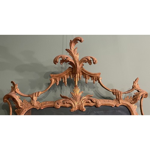 452 - A pair of George III giltwood mirrors, with later plates, each carved with waved pierced rectangular... 