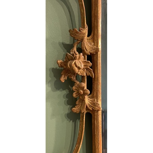 452 - A pair of George III giltwood mirrors, with later plates, each carved with waved pierced rectangular... 