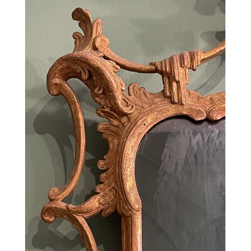 452 - A pair of George III giltwood mirrors, with later plates, each carved with waved pierced rectangular... 