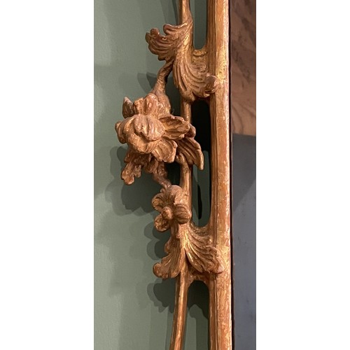 452 - A pair of George III giltwood mirrors, with later plates, each carved with waved pierced rectangular... 