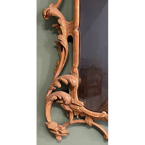 452 - A pair of George III giltwood mirrors, with later plates, each carved with waved pierced rectangular... 