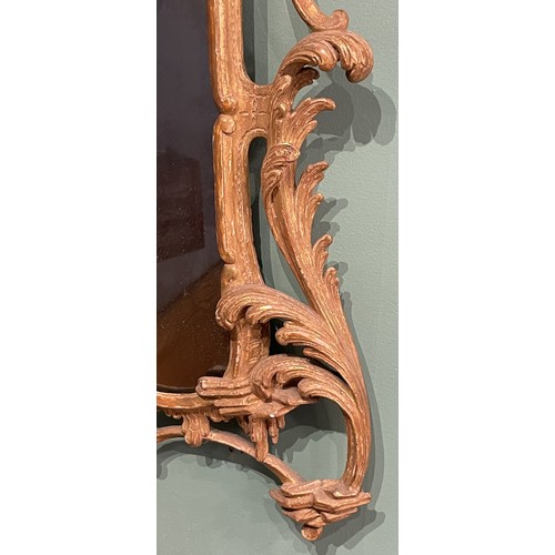 452 - A pair of George III giltwood mirrors, with later plates, each carved with waved pierced rectangular... 