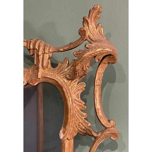 452 - A pair of George III giltwood mirrors, with later plates, each carved with waved pierced rectangular... 