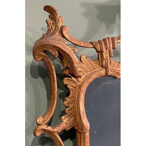 452 - A pair of George III giltwood mirrors, with later plates, each carved with waved pierced rectangular... 