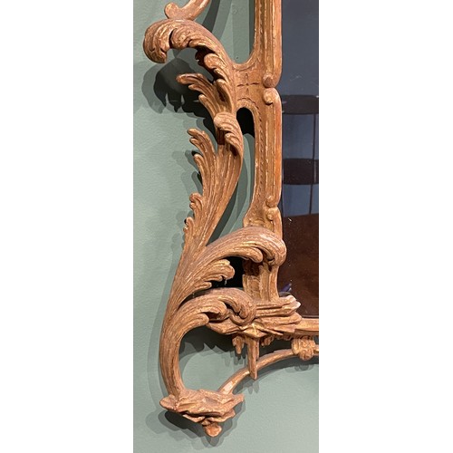 452 - A pair of George III giltwood mirrors, with later plates, each carved with waved pierced rectangular... 