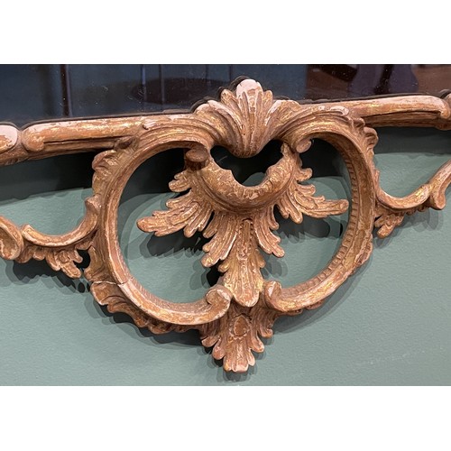 452 - A pair of George III giltwood mirrors, with later plates, each carved with waved pierced rectangular... 