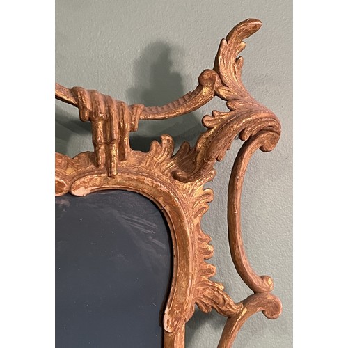 452 - A pair of George III giltwood mirrors, with later plates, each carved with waved pierced rectangular... 