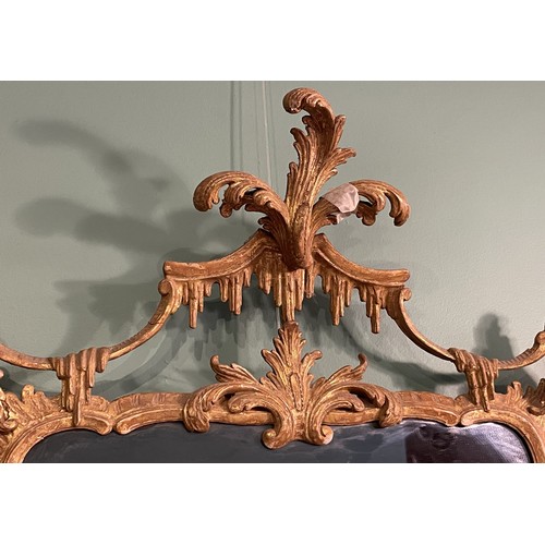 452 - A pair of George III giltwood mirrors, with later plates, each carved with waved pierced rectangular... 