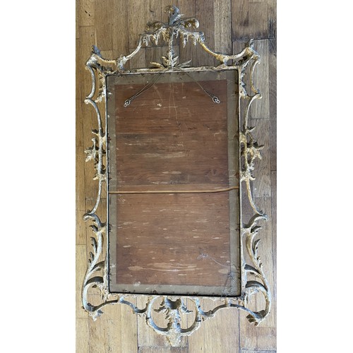 452 - A pair of George III giltwood mirrors, with later plates, each carved with waved pierced rectangular... 