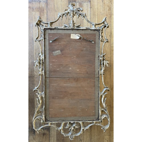452 - A pair of George III giltwood mirrors, with later plates, each carved with waved pierced rectangular... 