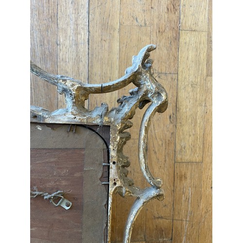 452 - A pair of George III giltwood mirrors, with later plates, each carved with waved pierced rectangular... 