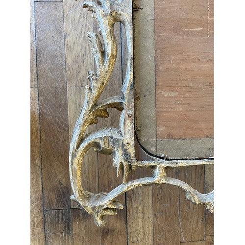 452 - A pair of George III giltwood mirrors, with later plates, each carved with waved pierced rectangular... 