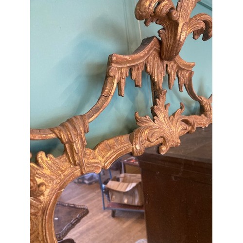 452 - A pair of George III giltwood mirrors, with later plates, each carved with waved pierced rectangular... 