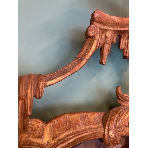 452 - A pair of George III giltwood mirrors, with later plates, each carved with waved pierced rectangular... 