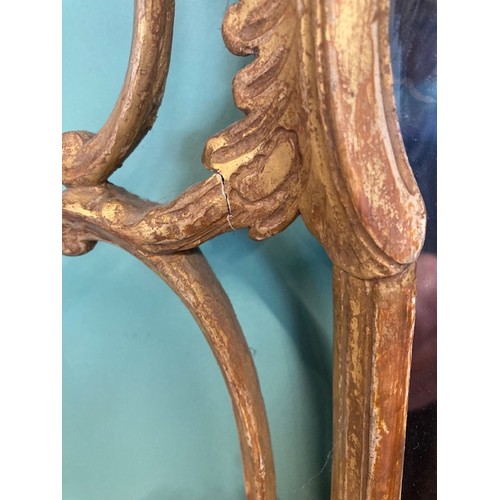 452 - A pair of George III giltwood mirrors, with later plates, each carved with waved pierced rectangular... 
