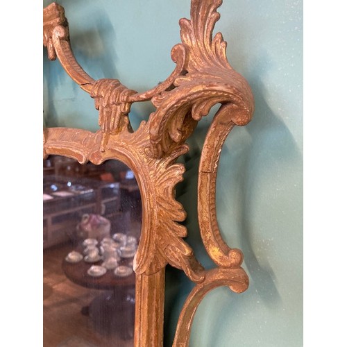452 - A pair of George III giltwood mirrors, with later plates, each carved with waved pierced rectangular... 