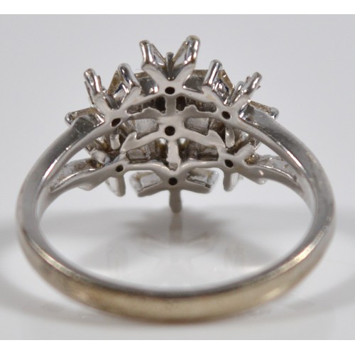 11 - A 9ct white gold vari cut diamond floral dress ring, O, 3.9g