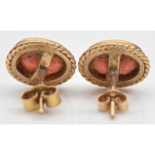 14 - A pair of 9ct gold garnet earrings with scroll backs, 2g