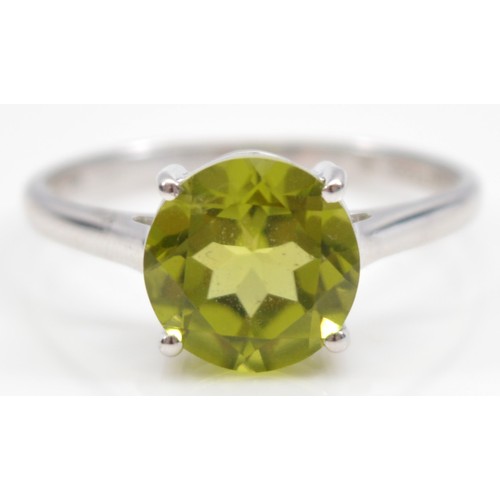 17 - A TGGC 9ct white gold peridot solitaire ring, Birmingham 2014, Q, 2.6g
