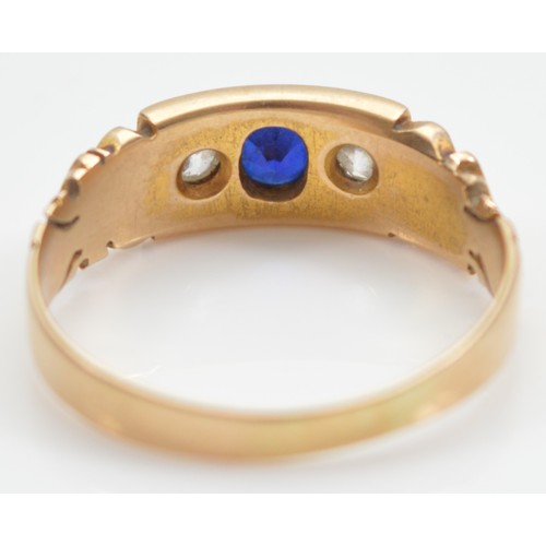 18 - A 15ct gold sapphire and old brilliant cut diamond three stone ring, hallmarks worn, P, 3.2g