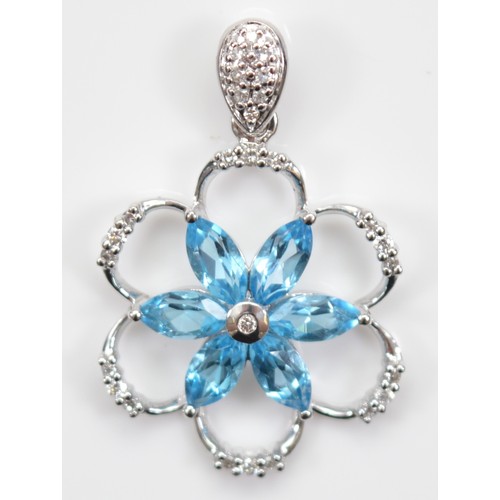 28 - A 9ct white gold brilliant cut diamond and blue topaz floral pendant, 20mm, 2.4g