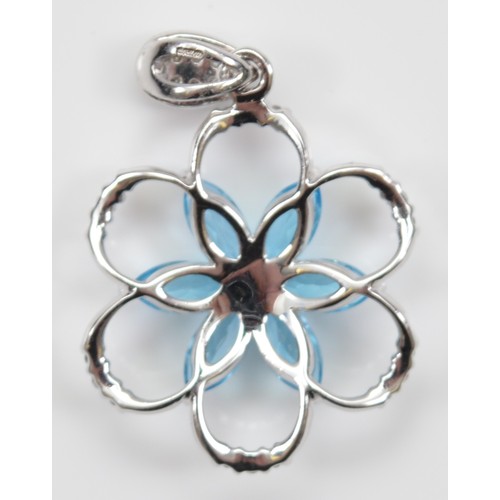 28 - A 9ct white gold brilliant cut diamond and blue topaz floral pendant, 20mm, 2.4g