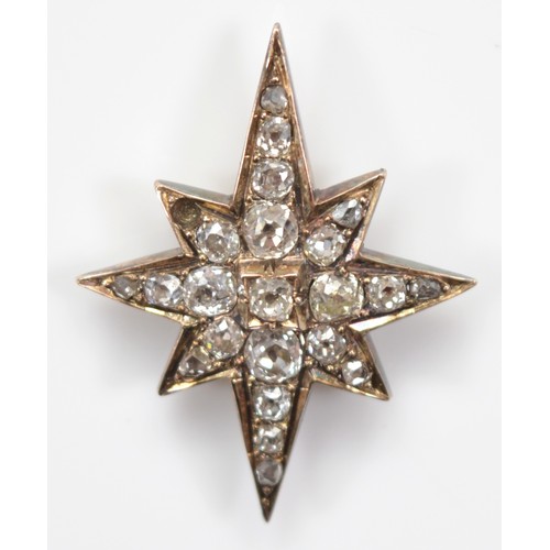 30 - A Victorian unmarked 9ct gold and silver set old mine cut diamond star, possibly from the front of a... 