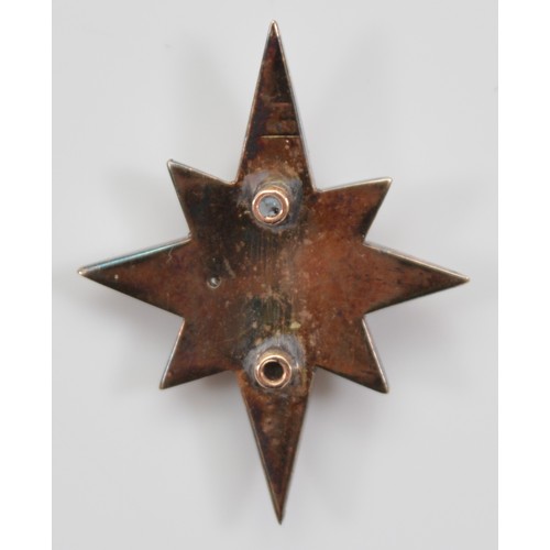 30 - A Victorian unmarked 9ct gold and silver set old mine cut diamond star, possibly from the front of a... 