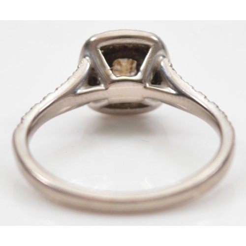 41 - An 18ct white gold diamond cluster ring, claw set with a Princess cut stone weighing approximately 0... 