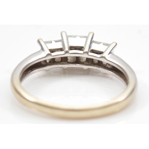 42 - An 18ct white gold Princess cut diamond dress ring, claw set with four stones of approximately 0.15c... 