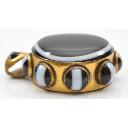 43 - A Victorian gold plated and banded agate mourning locket pendant, 43mm