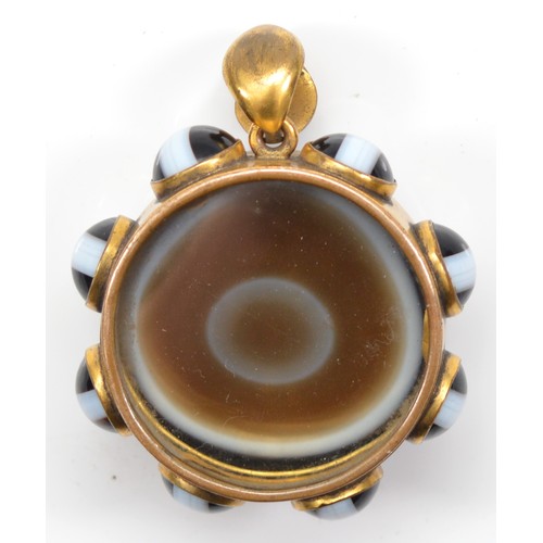 43 - A Victorian gold plated and banded agate mourning locket pendant, 43mm